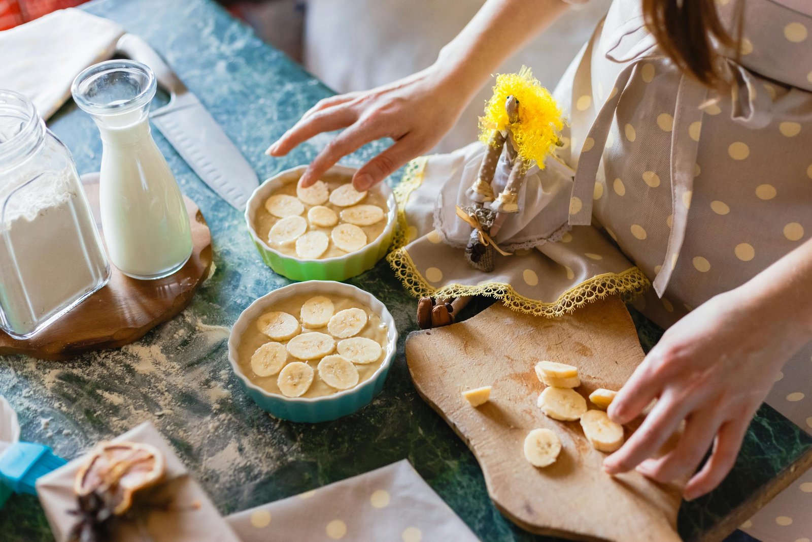 Close-up of homemade banana pie preparation with milk and flour.